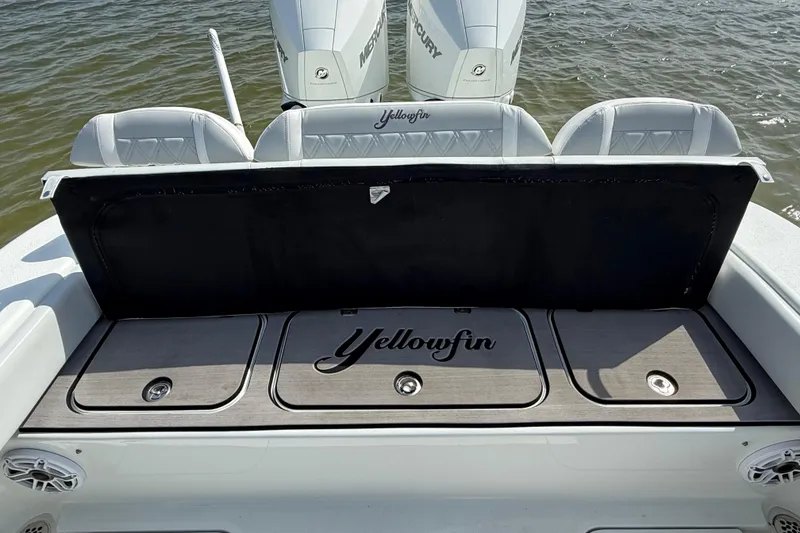 Slide: The Image of 2023 Yellowfin 26 Hybrid boat with Mercury engines, featuring sleek seating and storage compartments. - 15