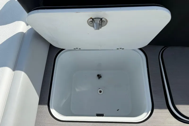 Slide: The Image of Open storage compartment on 2023 Yellowfin 26 Hybrid boat. - 20