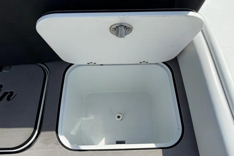 Slide: The Image of Open storage compartment on 2023 Yellowfin 26 Hybrid boat. - 21
