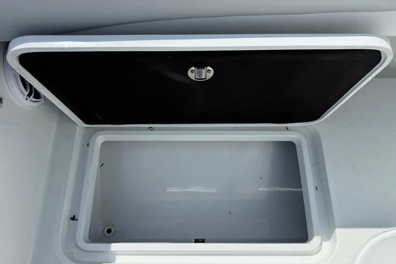 Slide: The Image of Open storage compartment on 2023 Yellowfin 26 Hybrid boat. - 24
