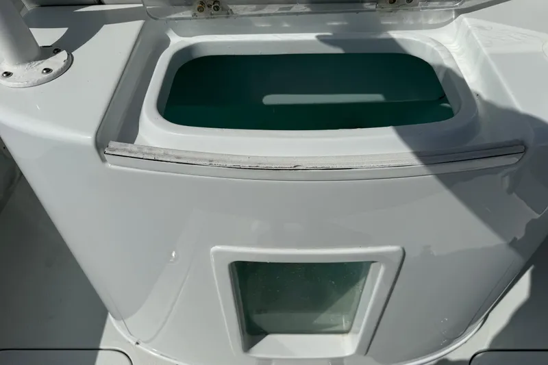 Slide: The Image of Livewell on 2023 Yellowfin 26 Hybrid boat, featuring a sleek white design. - 28