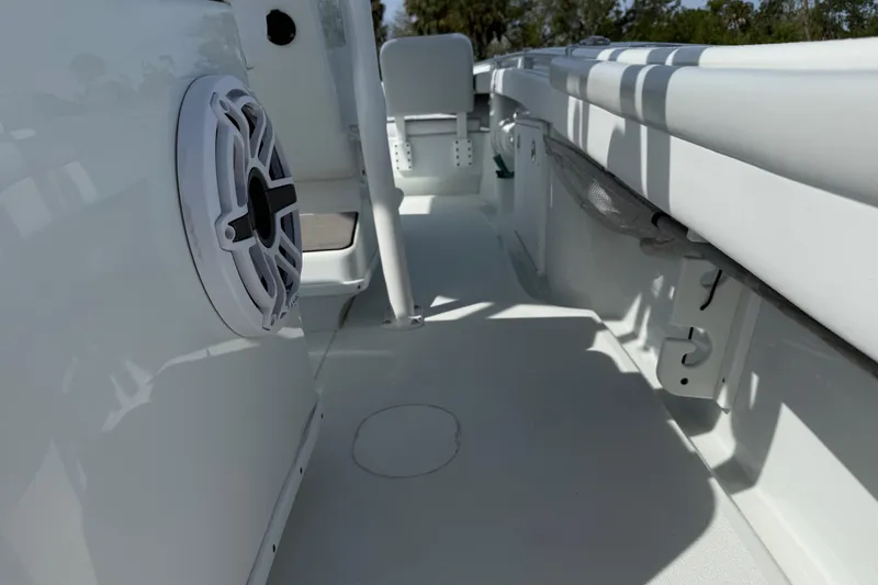Slide: The Image of 2023 Yellowfin 26 Hybrid boat interior with speaker and seating area. - 29