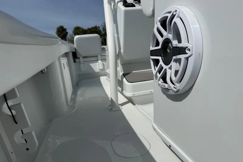 Slide: The Image of 2023 Yellowfin 26 Hybrid boat interior with speaker and seating. - 30