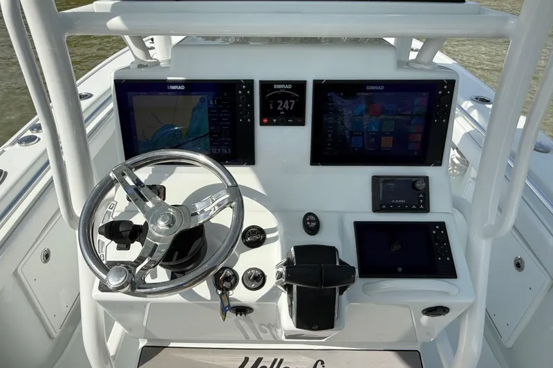 Slide: The Image of 2023 Yellowfin 26 Hybrid boat dashboard with advanced navigation and control systems. - 35