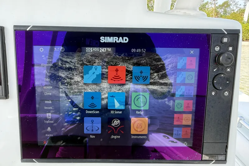 Slide: The Image of Simrad display on 2023 Yellowfin 26 Hybrid boat showing navigation and sonar options. - 37