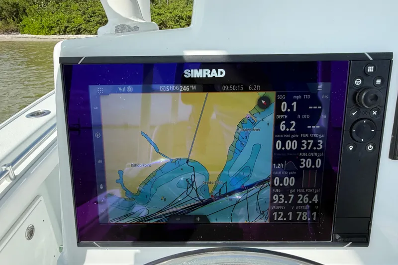 Slide: The Image of Simrad navigation display on 2023 Yellowfin 26 Hybrid boat, showing marine map and data. - 38