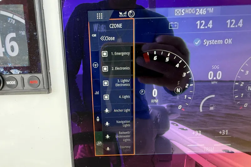Slide: The Image of Dashboard of a 2023 Yellowfin 26 Hybrid boat displaying control settings and system status. - 44
