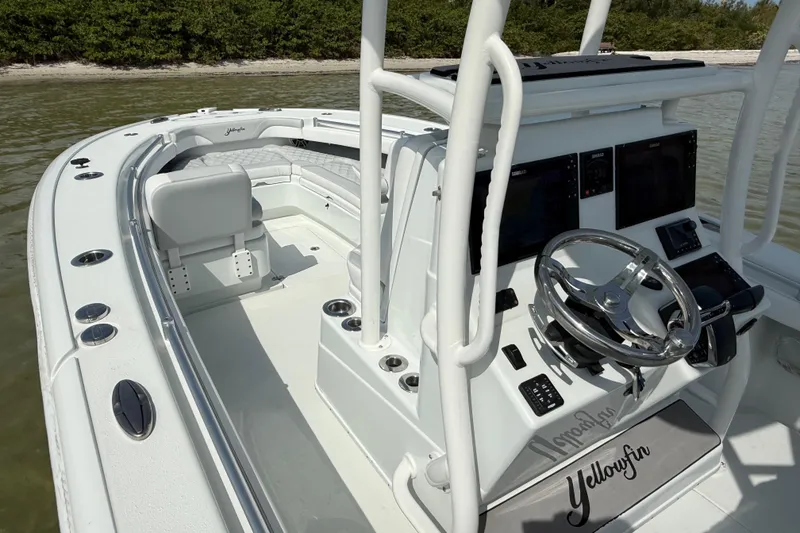 Slide: The Image of 2023 Yellowfin 26 Hybrid boat interior with modern helm and seating. - 45