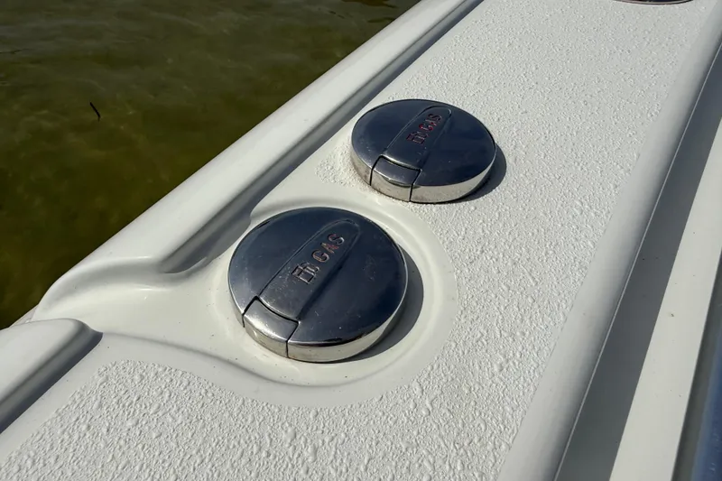 Slide: The Image of Fuel caps on a 2023 Yellowfin 26 Hybrid boat deck. - 47