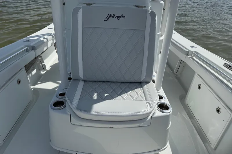 Slide: The Image of 2023 Yellowfin 26 Hybrid boat seat with diamond stitching and cup holders. - 49