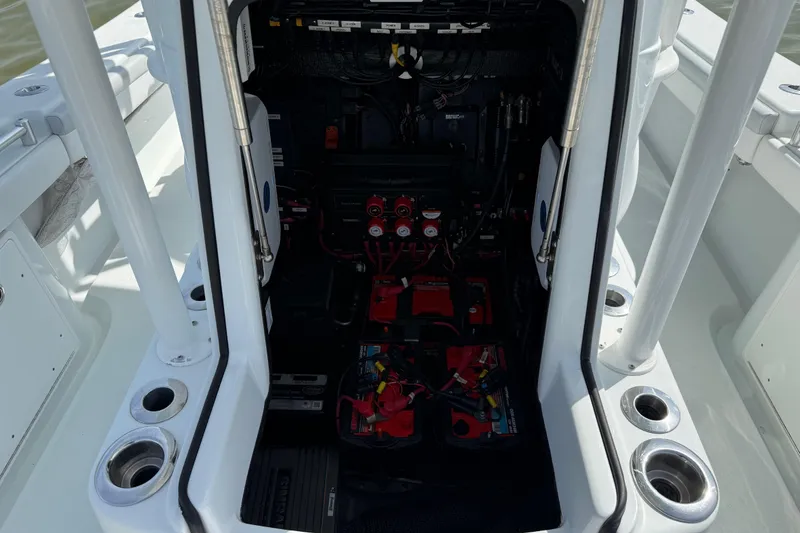 Slide: The Image of 2023 Yellowfin 26 Hybrid boat interior showing battery compartment and wiring. - 53