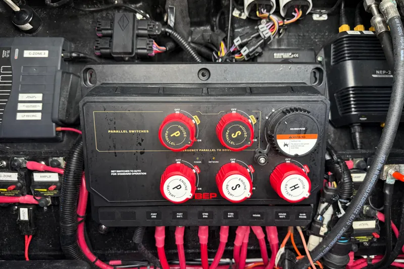 Slide: The Image of Electrical panel of a 2023 Yellowfin 26 Hybrid boat with switches and wiring. - 56