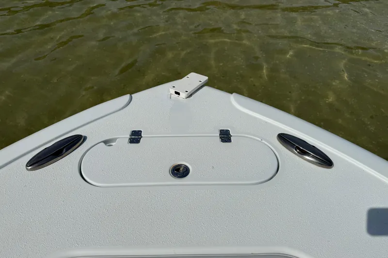 Slide: The Image of Bow of 2023 Yellowfin 26 Hybrid boat on calm water. - 62