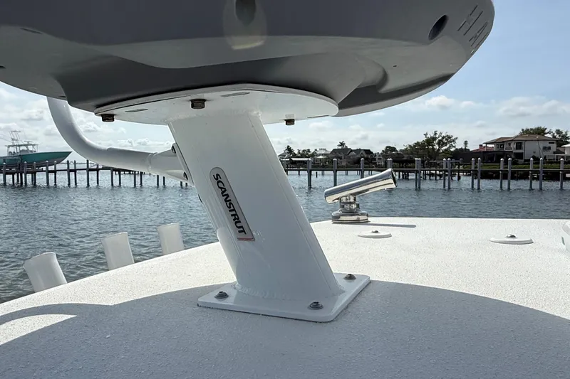 Slide: The Image of 2023 Yellowfin 26 Hybrid boat with Scanstrut mount, docked by the water. - 68