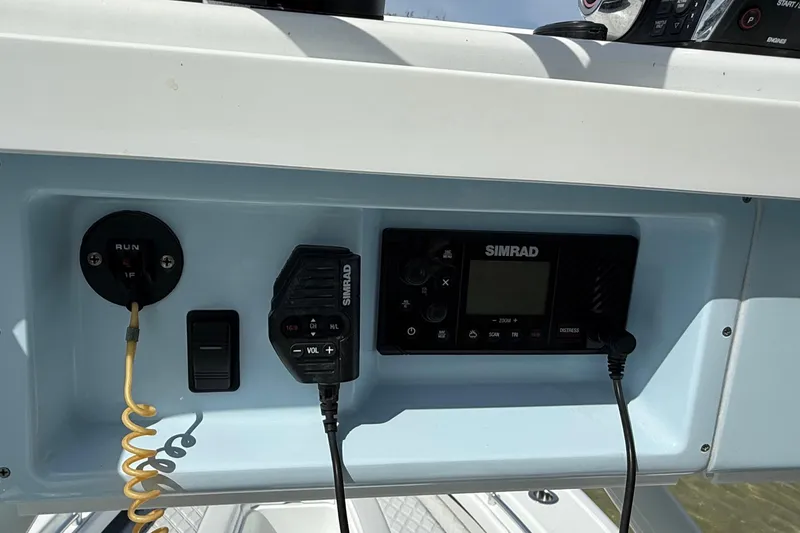 Slide: The Image of Control panel of 2023 Yellowfin 26 Hybrid boat with Simrad electronics. - 72