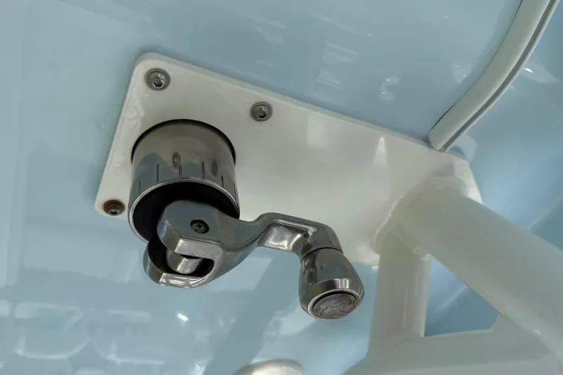 Slide: The Image of Close-up of a 2023 Yellowfin 26 Hybrid boat component, featuring a metallic handle. - 73