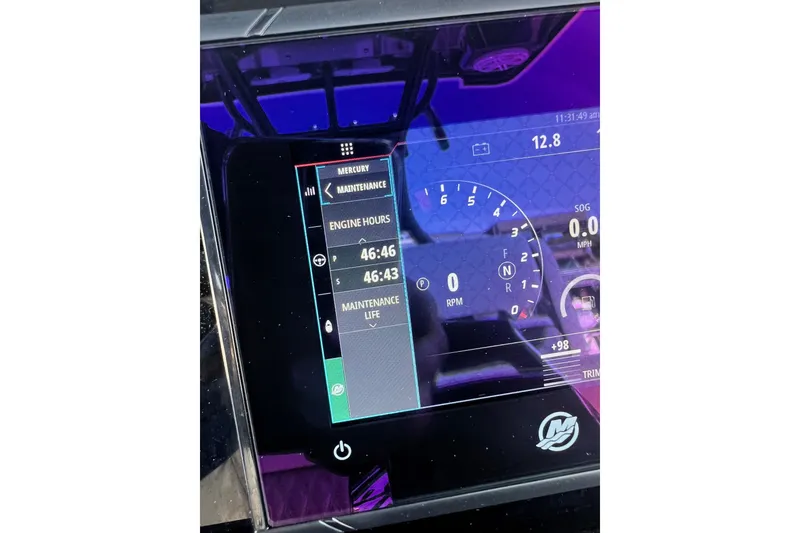 Slide: The Image of Dashboard display of a 2023 Blackfin 302 CC boat showing engine hours and maintenance data. - 11