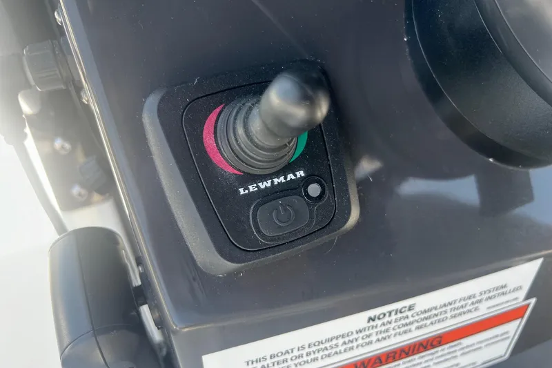 Slide: The Image of Close-up of Lewmar joystick control on 2023 Blackfin 302 CC boat dashboard. - 12