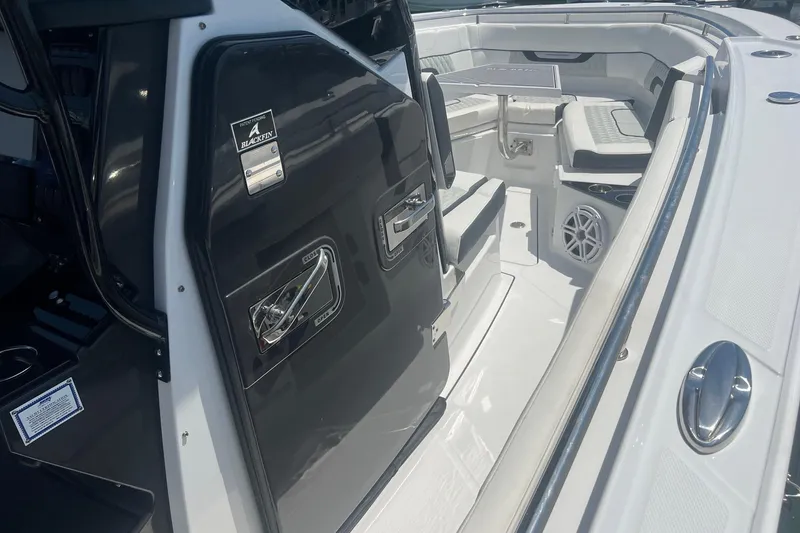 Slide: The Image of 2023 Blackfin 302 CC boat interior with seating and sleek design. - 17
