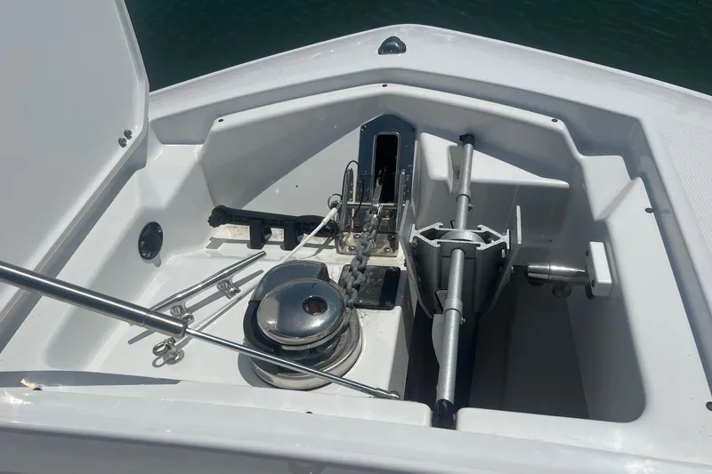 Slide: The Image of 2023 Blackfin 302 CC anchor compartment with stainless steel fittings and marine equipment. - 5