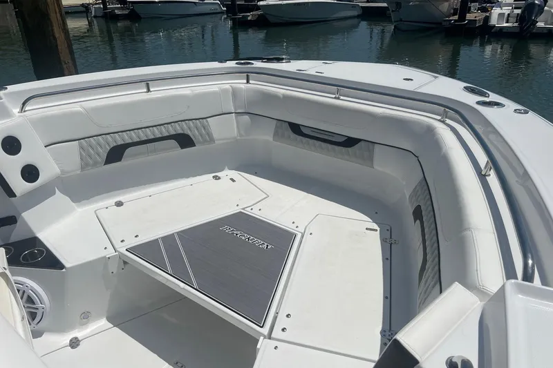 Slide: The Image of 2023 Blackfin 302 CC boat interior with spacious seating and sleek design. - 6