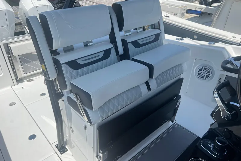 Slide: The Image of 2023 Blackfin 302 CC boat interior with modern seating and controls. - 9