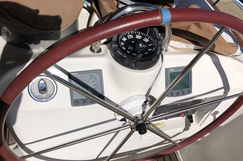 Slide: The Image of Steering wheel and navigation instruments on a 2001 Beneteau 50 yacht. - 21