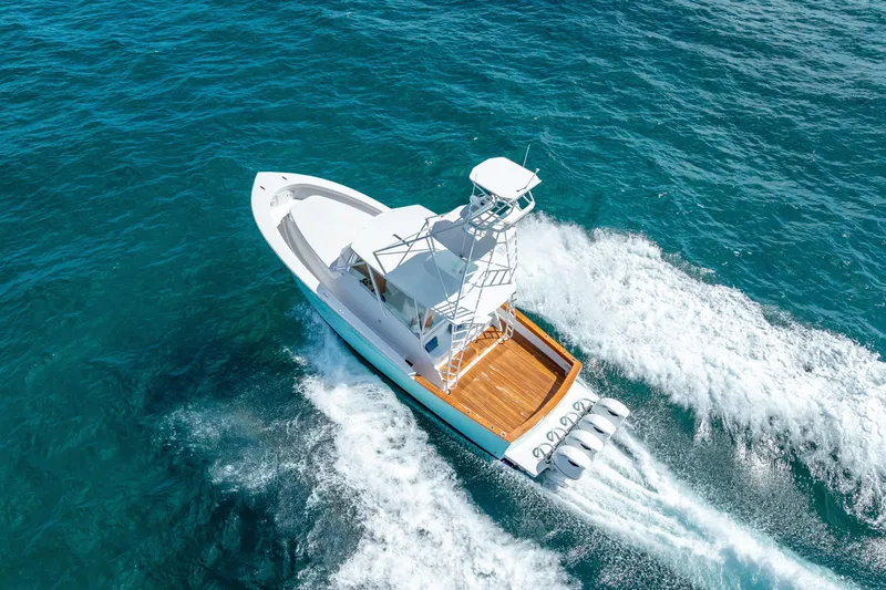 Slide: The Image of Aerial view of 2025 Rybovich Custom Margaritavich boat cruising on blue ocean waters. - 10