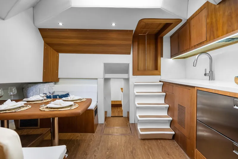 Slide: The Image of Luxurious interior of 2025 Rybovich Custom Margaritavich yacht with modern kitchen and dining area. - 21