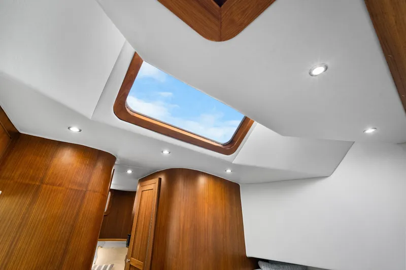 Slide: The Image of Interior of 2025 Rybovich Custom Margaritavich yacht with skylight and wooden paneling. - 26