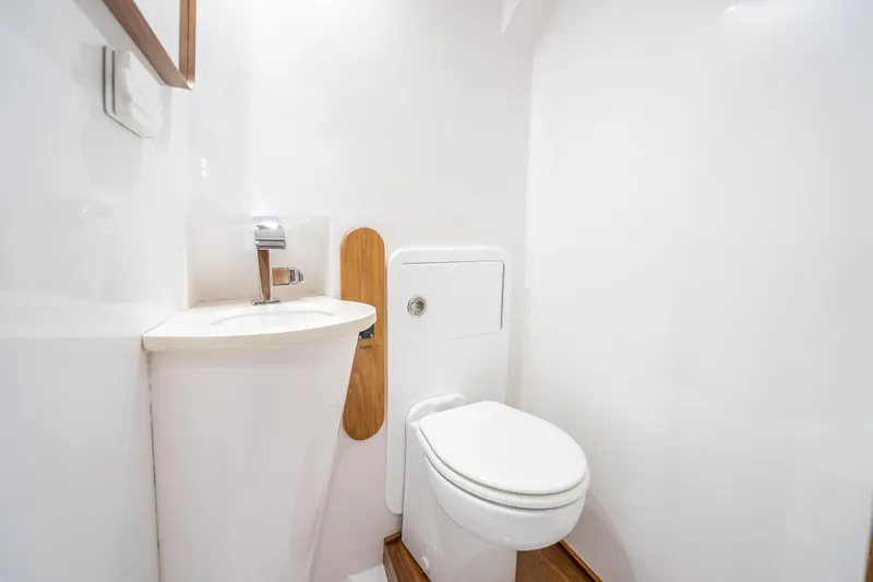 Slide: The Image of Modern bathroom in 2025 Rybovich Custom Margaritavich yacht, featuring sleek sink and toilet design. - 29