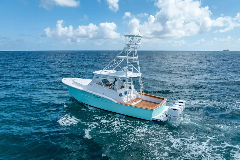 Slide: The Image of 2025 Rybovich Custom Margaritavich boat cruising on open ocean under blue sky. - 3