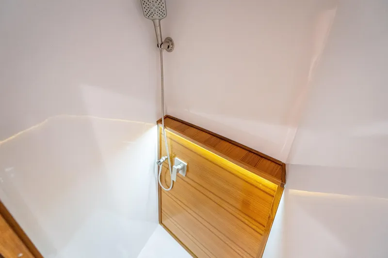 Slide: The Image of Shower area in 2025 Rybovich Custom Margaritavich yacht with sleek wooden accents. - 30