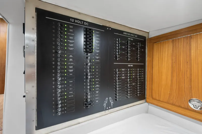 Slide: The Image of Electrical panel on 2025 Rybovich Custom Margaritavich yacht, featuring 12V DC and 240/120V AC systems. - 37