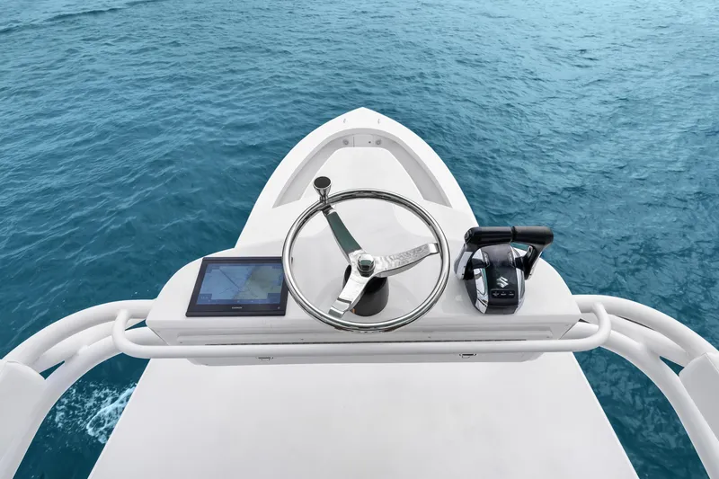 Slide: The Image of Helm of 2025 Rybovich Custom Margaritavich boat with steering wheel and controls. - 39