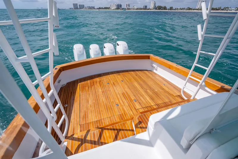 Slide: The Image of Custom Margaritavich 2025 boat deck with wooden flooring and ocean view. - 41