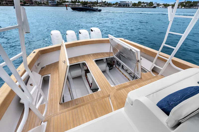 Slide: The Image of 2025 Rybovich Custom Margaritavich boat deck with open hatches, ocean view. - 44