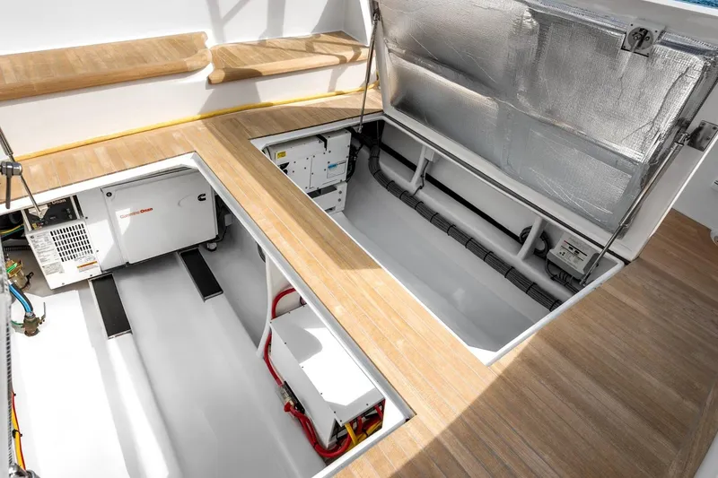 Slide: The Image of Engine compartment of 2025 Rybovich Custom Margaritavich yacht, showcasing modern equipment and storage. - 45
