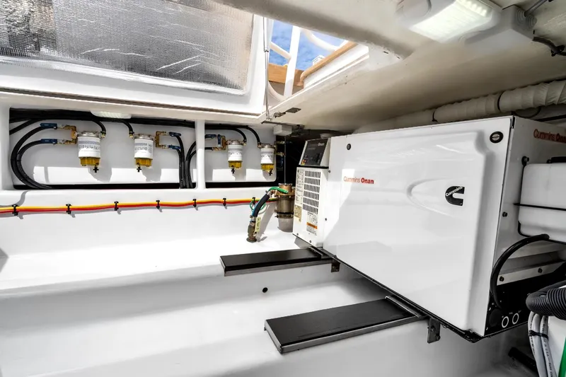 Slide: The Image of Engine room of 2025 Rybovich Custom Margaritavich with Cummins Onan generator and fuel filters. - 47