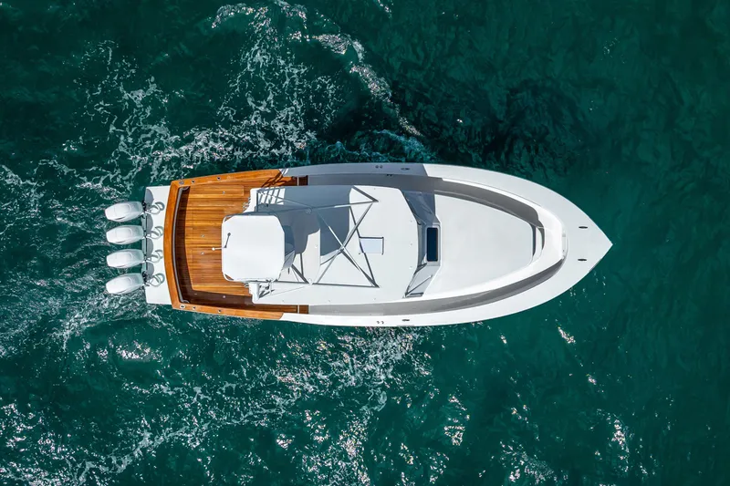 Slide: The Image of Aerial view of 2025 Rybovich Custom Margaritavich boat cruising on blue ocean waters. - 9