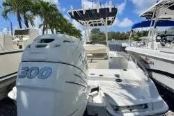 Slide: The Image of 2017 Boston Whaler 240 Outrage boat with powerful 300 horsepower engine docked. - 6