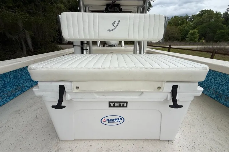 Slide: The Image of 2021 Young Boats Gulf Shores 24 with Yeti cooler and cushioned seating. - 13