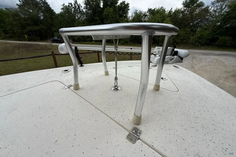 Slide: The Image of 2021 Young Boats Gulf Shores 24 deck with stainless steel grab rail and trolling motor. - 15