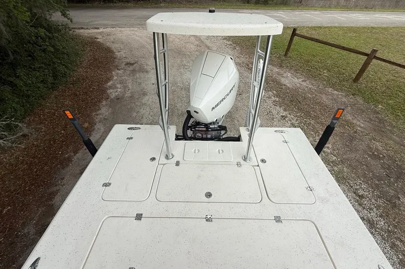 Slide: The Image of 2021 Young Boats Gulf Shores 24 with Mercury engine, viewed from above on a trailer. - 16