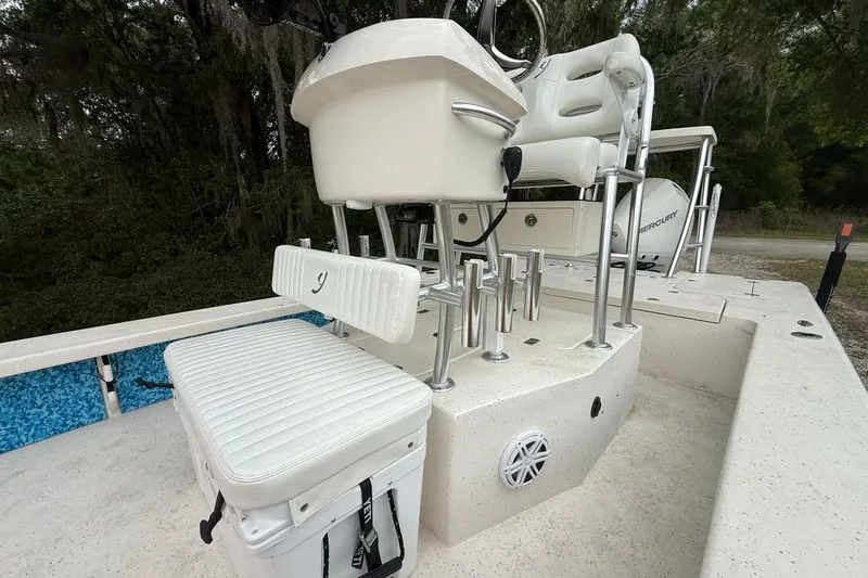 Slide: The Image of 2021 Young Boats Gulf Shores 24 interior with seating and rod holders. - 6