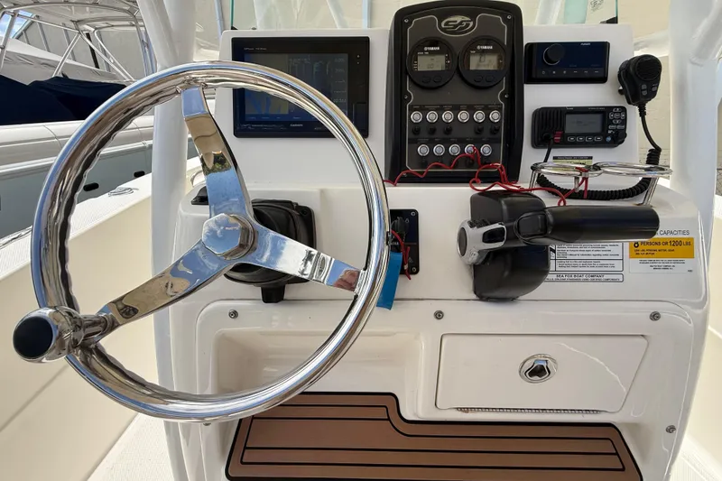Slide: The Image of Helm of 2016 Sea Fox 226 Commander with steering wheel, controls, and navigation equipment. - 10
