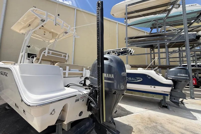 Slide: The Image of 2016 Sea Fox 226 Commander boat with Yamaha engine in storage facility. - 19