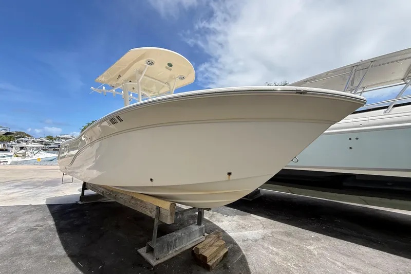 Slide: The Image of 2016 Sea Fox 226 Commander boat on display under a clear blue sky. - 2