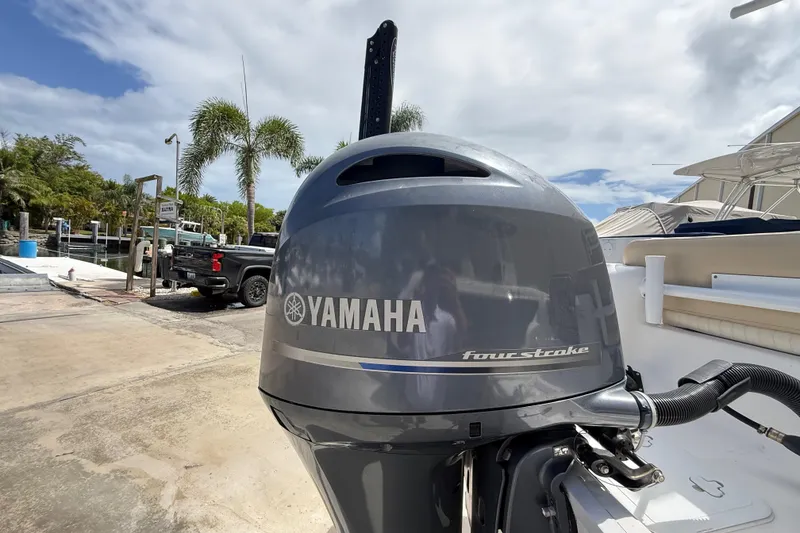 Slide: The Image of Yamaha four-stroke engine on a 2016 Sea Fox 226 Commander boat, dockside view. - 21