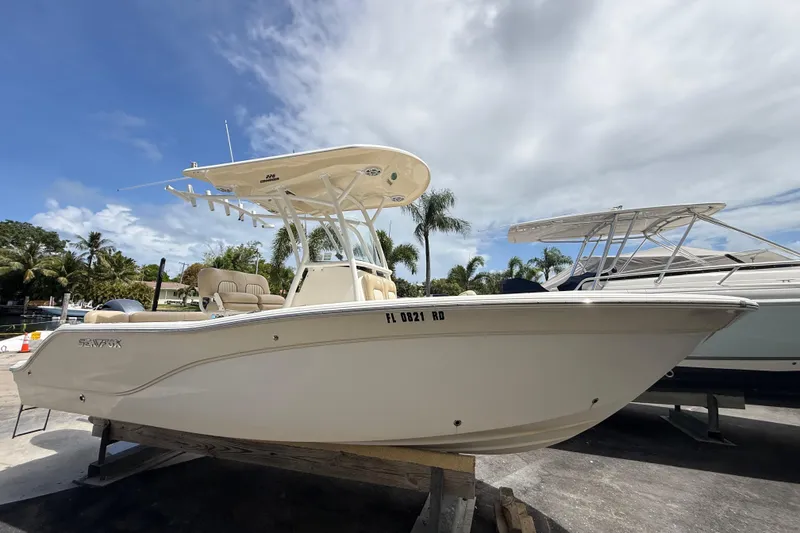 Slide: The Image of 2016 Sea Fox 226 Commander boat on display under a cloudy sky. - 3